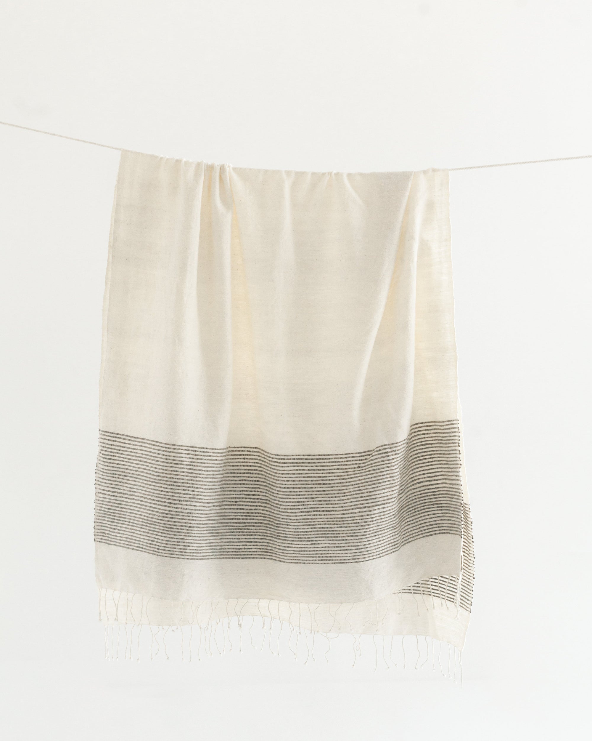 Riviera Cotton Throw Blanket Hanging on Line