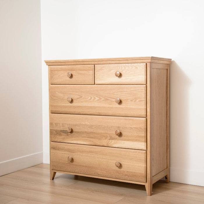 Wooden dresser with multiple drawers in a room setting