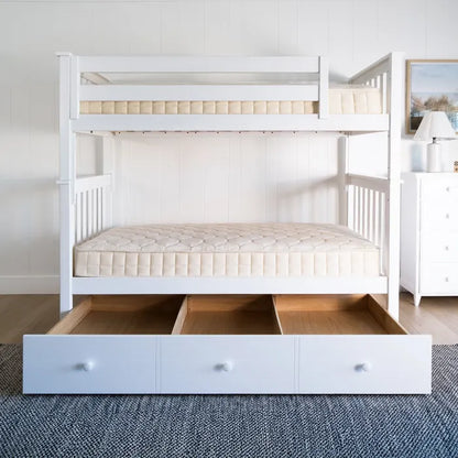 White bunk bed with storage drawers in a room setting