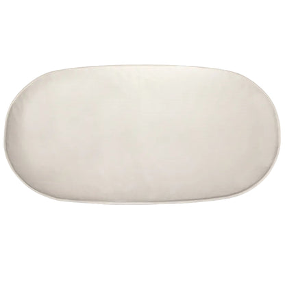 organic oval crib mattress on a white background