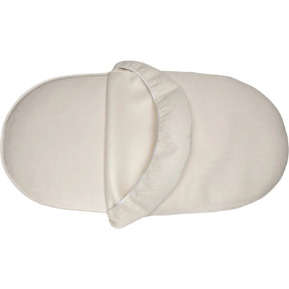 oval crib mattress with a fitted sheet on a white background
